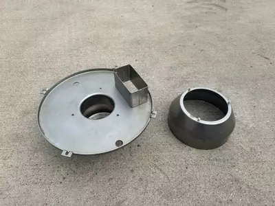 Refurbished burner cowl components from Nilfisk Contractor diesel hot pressure washer after cleaning.